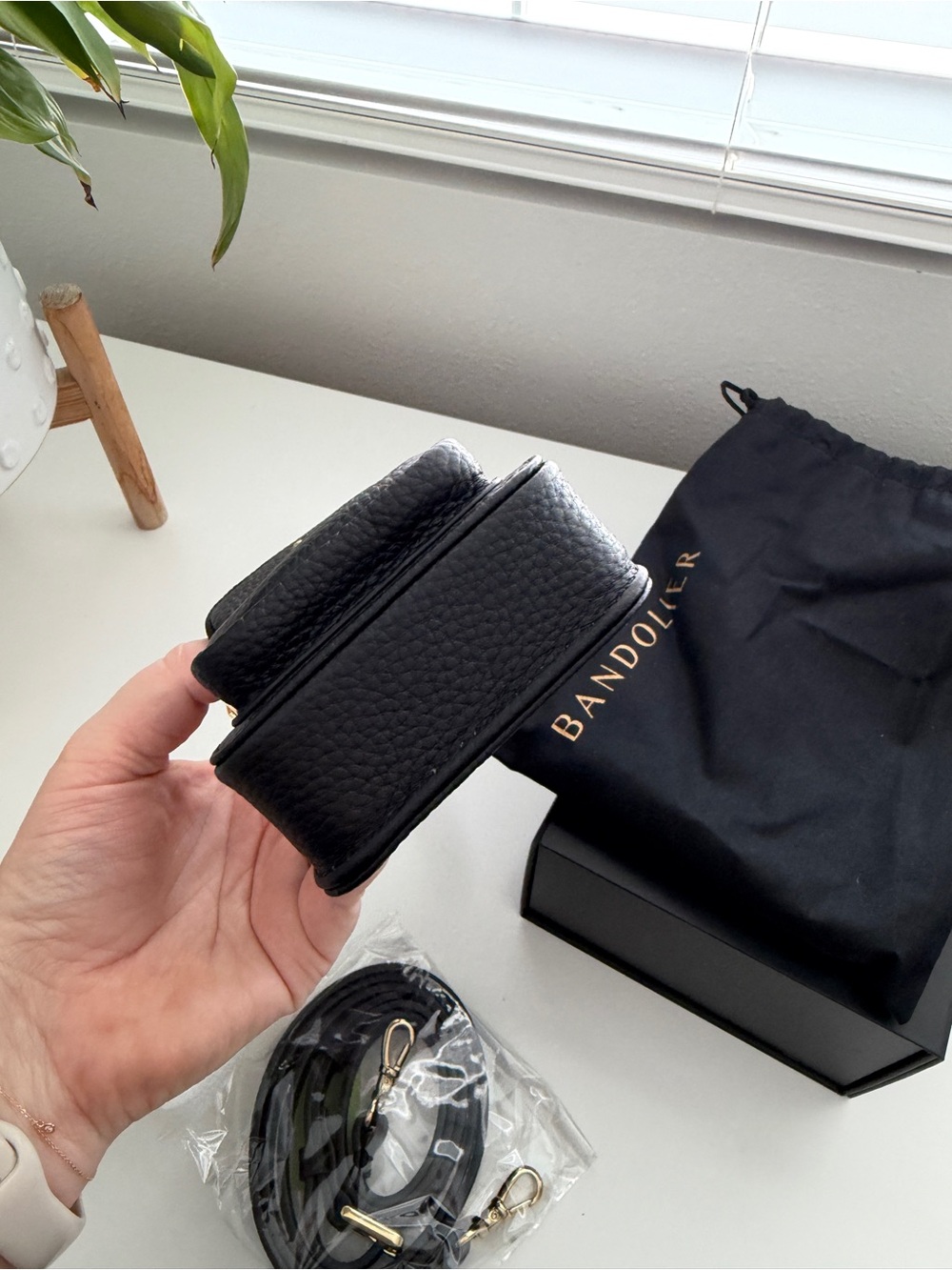 Bandolier Black Pebbled Leather Crossbody Phone Pouch with Gold Accents - Picture 9 of 9